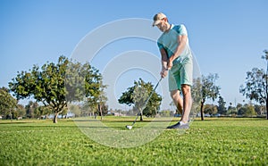 summer activity. professional sport outdoor. male golf player on professional golf course