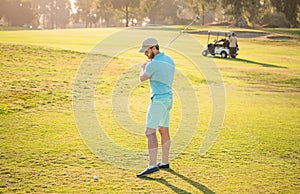 summer activity. professional sport outdoor. male golf player on professional golf course.