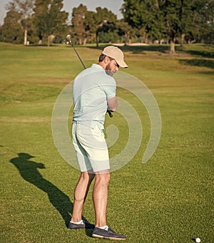 summer activity. professional sport outdoor. male golf player on professional golf course.