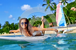 Summer Adventure. Water Sports. Woman Surfing In Sea. Travel Vac photo