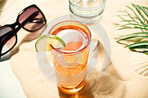 Summer alcoholic cocktails in colorful glasses on beach with white sand. Summer sea ocean vacation and travel concept