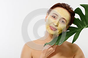 Summer anti aging collagen mask on middle age woman wrinkle face isolated on white background. Skin care spa and menopause concept