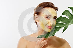 Summer anti aging collagen mask on middle age woman wrinkle face isolated on white background. Skin care spa and menopause concept