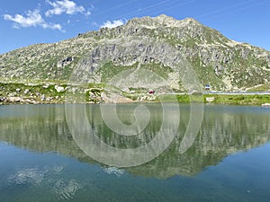 Summer atmosphere on the Lago dei Banchi or Lake Banchi in the Swiss alpine area of mountain St. Gotthard Pass Gotthardpass photo