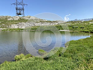 Summer atmosphere on the Lago dei Banchi or Lake Banchi in the Swiss alpine area of mountain St. Gotthard Pass Gotthardpass photo