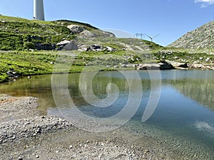 Summer atmosphere on the Lago dei Banchi or Lake Banchi in the Swiss alpine area of mountain St. Gotthard Pass Gotthardpass photo