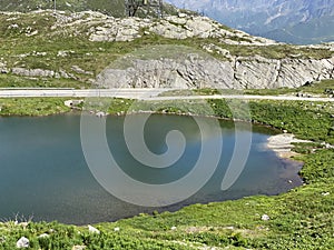 Summer atmosphere on the Lago dei Banchi or Lake Banchi in the Swiss alpine area of mountain St. Gotthard Pass Gotthardpass photo