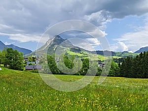 Summer austrian landscape with green meadows and impressive mountains, view from small alpine village Tauplitz, Styria region,