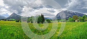 Summer austrian landscape with Grimming mountain 2.351 m, an isolated peak in the Dachstein Mountains, view from small alpine