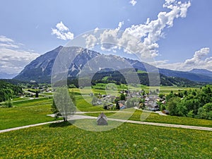 Summer austrian landscape with Grimming mountain 2.351 m, an isolated peak in the Dachstein Mountains, view from small alpine