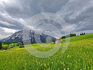 Summer austrian landscape with Grimming mountain 2.351 m, an isolated peak in the Dachstein Mountains, view from small alpine