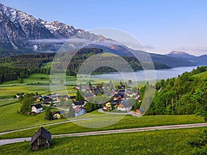 Summer austrian landscape with Grimming mountain 2.351 m, an isolated peak in the Dachstein Mountains, view from small alpine