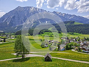 Summer austrian landscape with Grimming mountain 2.351 m, an isolated peak in the Dachstein Mountains, view from small alpine