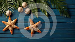 Summer background with beach sand starfishs coconut leaves and shells decoration hanging on blue wood background