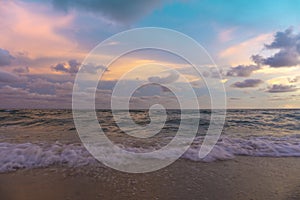 Summer background with beautiful sunset seascape on the beach