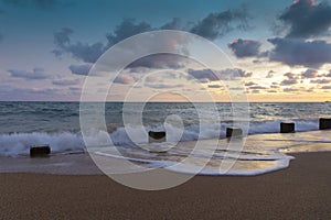 Summer background with beautiful sunset seascape on the beach