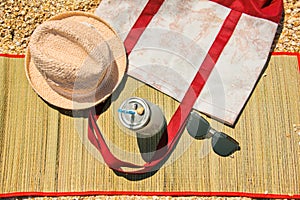 Summer background. Glasses, hat and summer bag on the shells