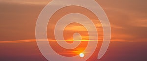 Summer background with sunset in the orange sky and clouds background texture banner