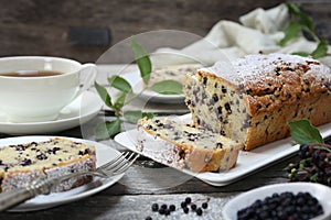 Summer baking. Black elderberry cake and cup of tea for summer tea party