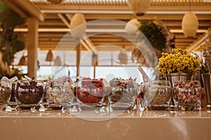 Summer bar on the beach with ingredients for cocktails .This bar is made with cane bamboo,wooden and straw rope.Summer