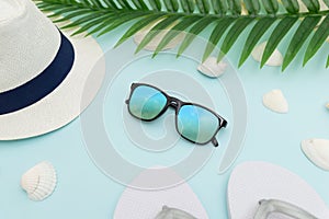 Summer beach accessories on blue background