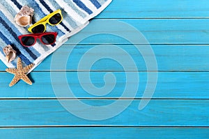 Summer beach background border, starfish, sunglasses, blue wood