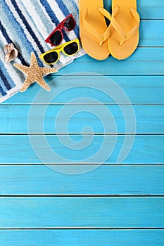 Summer beach background, sunglasses, flip flops, starfish, copy space, vertical