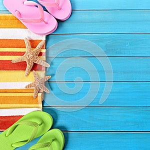 Summer beach border, sunglasses, flip flops, blue wood copy space square