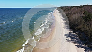 A summer beach on the coast of Poland, the Baltic Sea, aerial view.