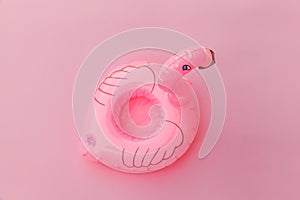 Summer beach composition. Simply minimal design with Inflatable flamingo isolated on pastel pink background. Pool float party,