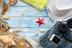 Summer beach concept. Summer accessories on a wooden background