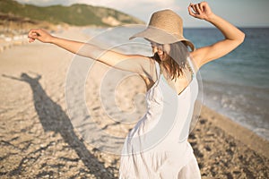 Summer beach fashion woman enjoying summer and sun.Concept of summer feeling,happiness