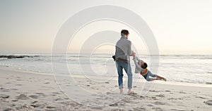 Summer, beach and a father swinging his son outdoor by the ocean while playing or bonding on vacation. Family, children