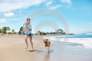 Summer Beach Fun. Woman Running With Dog. Holidays Vacations. Summer