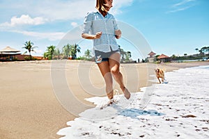 Summer Beach Fun. Woman Running With Dog. Holidays Vacations. Summer