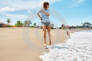 Summer Beach Fun. Woman Running With Dog. Holidays Vacations. Summer