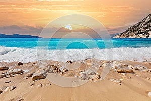 Summer beach in Greece at sunset. Myrtos beach