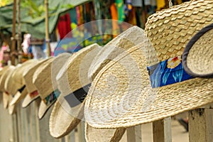 Summer beach hats on display at craft market
