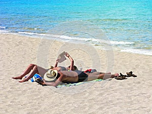 Summer, beach holidays, couple, sunbathe, sea