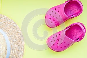 Summer beach,straw hat and flip flops on yellow background.Copy space.text or your design Creative Top View. Concept