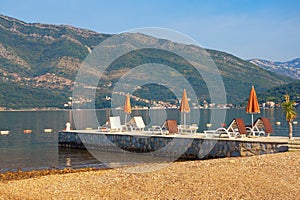 Summer beach vacation. Beautiful sunny Mediterranean landscape. Montenegro, Adriatic Sea, Bay of Kotor