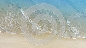 Summer beach in wave of turquoise sea water shot, Top view of beautiful white sand background