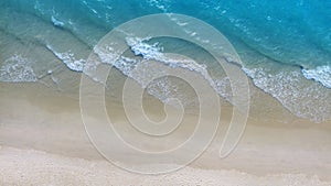 Summer beach in wave of turquoise sea water shot, Top view of beautiful white sand background