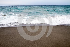 Summer with beautiful beach in Calabria and waves