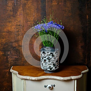 Summer beautiful wildflowers cornflowers in a vintage vase
