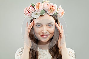 Summer Beauty Portrait of Pretty Model Woman with Brown Hair, Natural Makeup and Pink Flowers. Beautiful Female Face