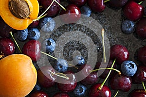 Summer berries and fruits. Sweet cherries, blueberries and apricots