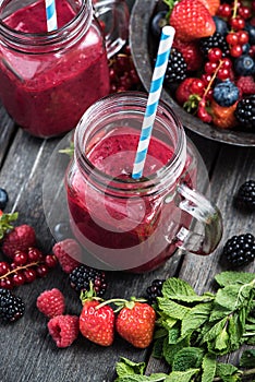 Summer berries smoothie in mason jar