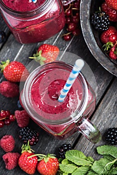 Summer berries smoothie in mason jar