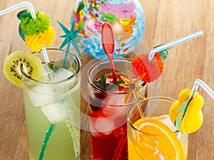 Summer beverages, cocktail with ice, juice and fruit.
